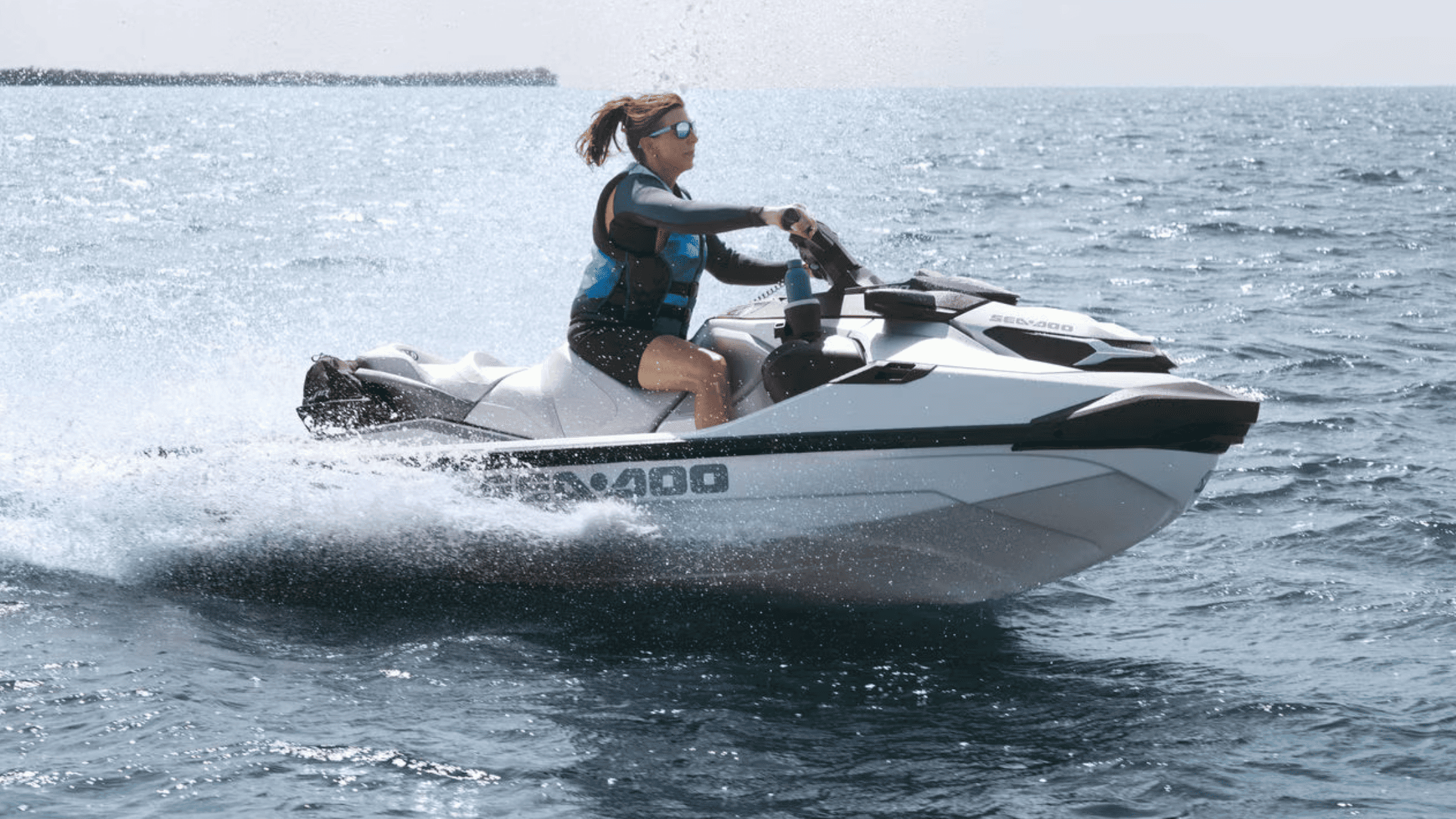 2024 Sea-Doo GTX™ 300 jet ski speeding across open water, rider in control.