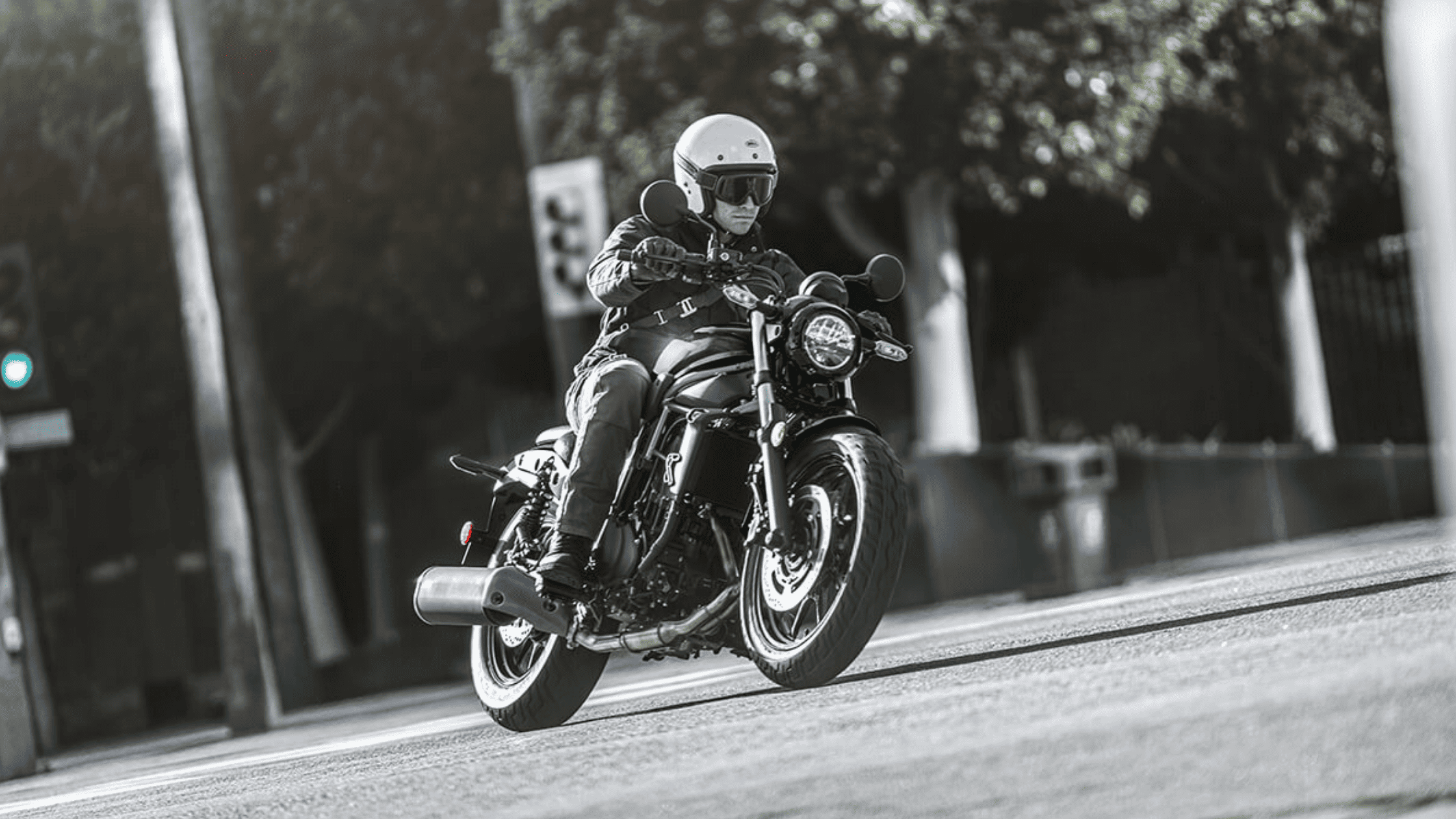 Rider on a Kawasaki Eliminator® motorcycle navigating urban streets.